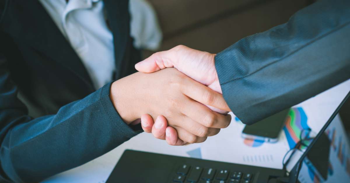 Business partners shaking hands