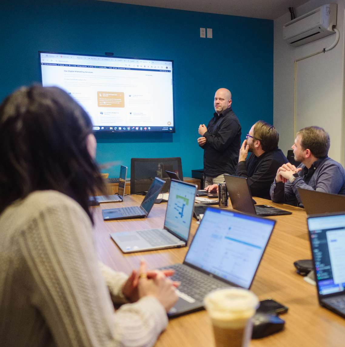 Online Marketing Agency Services - Online Marketing Services Employees Look At Online Marketing Trends On A Coworkers Computer