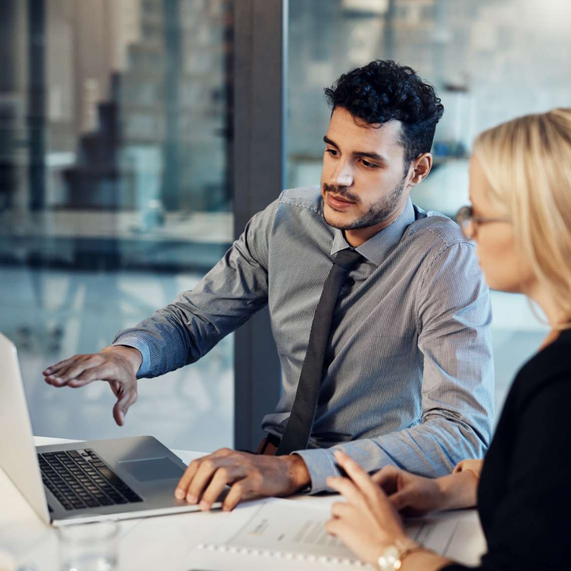 Investment professional speaking with client