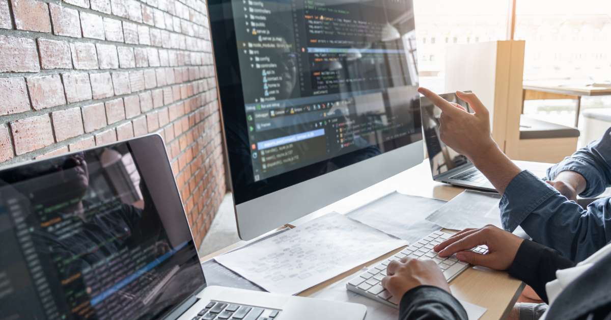 Developers reviewing website code